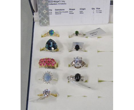 Nine silver and silver gilt dress rings of various design, to include a star diopside and diamond example, topaz and diamond,