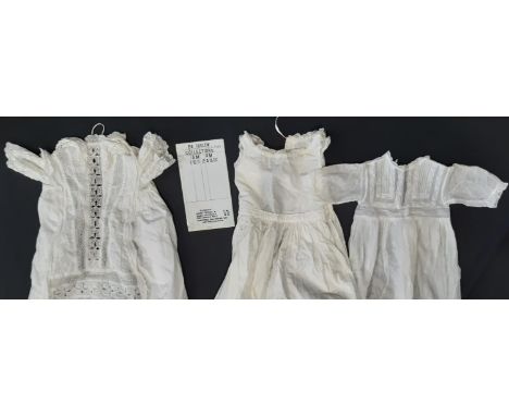 Two vintage white cotton baby gowns decorated with lace and pin tucks and two further gowns together with a Post Office post 
