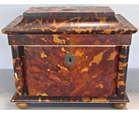 A Regency tortoiseshell tea caddy with two compartments, complete with covers, with a pagoda shaped lid and column supports, 