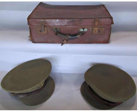 A vintage medical kit with stainless steel instruments, stitching thread contained in an old suitcase, and two British army o