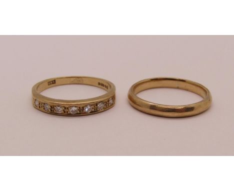 Two 9ct rings; a diamond set half hoop ring, size L and a wedding ring, size K, 3.4g total (2) 