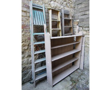 A vintage pine open bookcase/shelving unit with shaped brackets and overpainted finish, 122cm wide x 23cm deep x 150cm high, 
