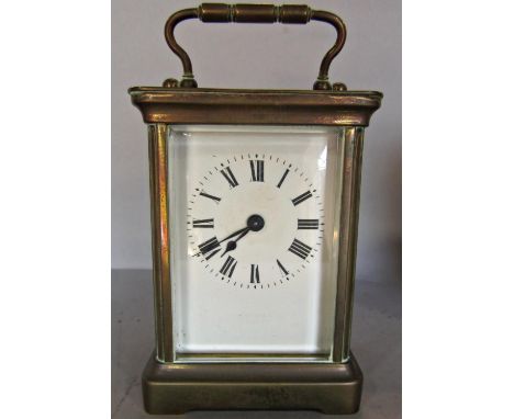 A simple French brass carriage clock with eight day time piece