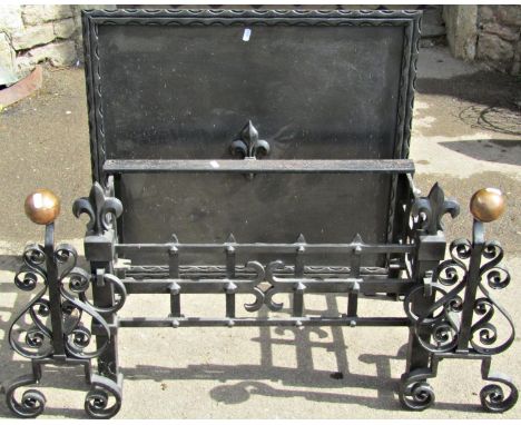 An antique style cast iron fire basket of rectangular form with fleur de-lys finials, (lacks internal grate) 65 cm wide, toge