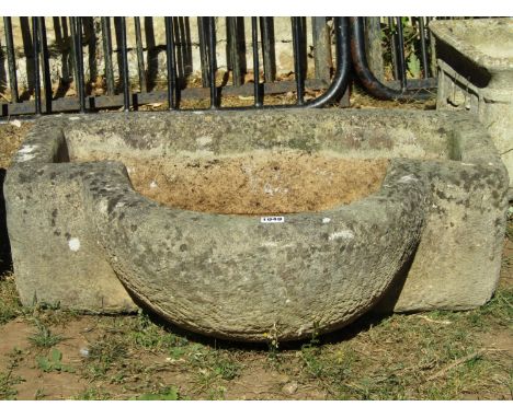 A weathered unusual natural stone bow fronted rectangular planter 76 cm wide x 57 cm deep x 24 cm high 