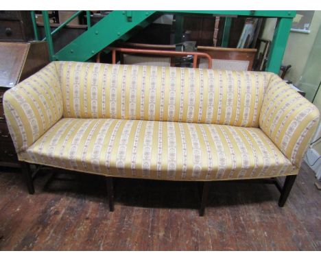 A Georgian style sofa with bow shaped outline, raised on six square tapered moulded supports, united by a central rail, 2m wi