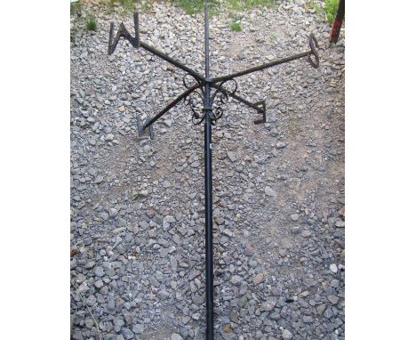 A wrought iron weather vane with simple scroll detail, mounted on a tubular stem/pole, (lacks finial 180cm high (af) 