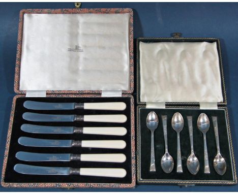 A cased set of six silver teaspoons, six silver collared Walker &amp; Hall butter knives and a silver knife and fork 