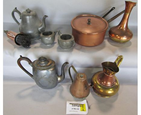 A mixed selection of brass and copper ware, jugs, bowls, saucepan, tea pots, a coffee grinder, loose flat ware etc 