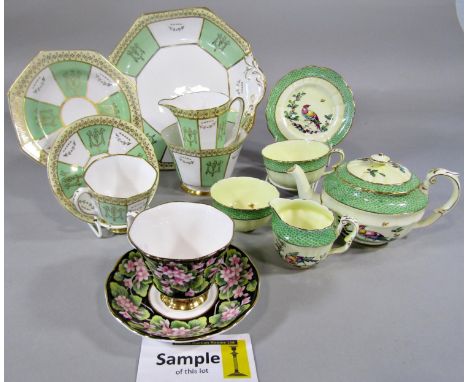 A Crown Staffordshire tea for two service with bird and green scale detail, a further Royal Stafford green and gilt tea servi