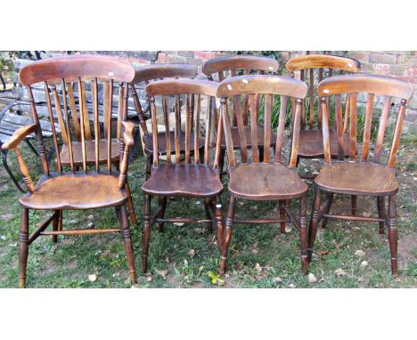 A harlequin set of six Windsor stained elm and beechwood lathe back kitchen chairs raised on turned supports and stretchers, 