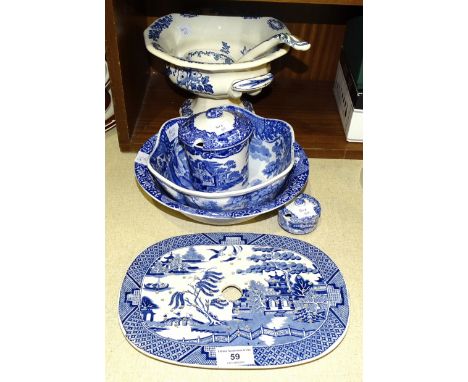 A 19th century willow pattern ceramic oval gravy strainer, 26.5 x 19.5cm, two Spode 'Italian' pattern blue and white bowls an