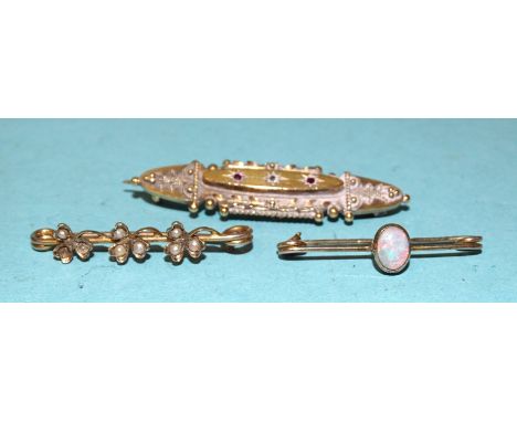 A Victorian 15ct gold brooch, 3.4g, a small 9ct gold brooch set opal and a small seed pearl-set gold brooch, (3). 