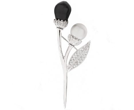 Black and White Baroque Pearl, Pave Set Diamond and 18 Karat White Gold Flower Brooch. Pearls measure 12.5mm. Stamped 18K. Me