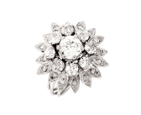Antique Approx. 1.90 Carat TW round Brilliant Cut Diamond and Platinum Starburst Ring. Set in the center with a .90 carat rou
