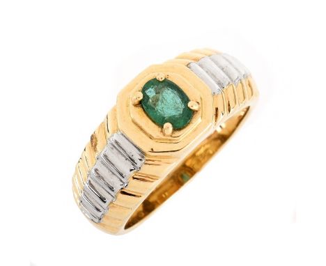 Man's Vintage Oval Cut Emerald and 14 Karat Yellow and White Gold Ring. Emerald measures 6mm x 4mm. Stamped 585. Ring size 8.