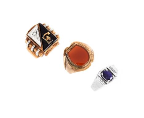 Three Vintage Man's 10 Karat Gold Rings, One Yellow Gold with Carnelian, One Yellow Gold with Black Onyx and Diamond and One 