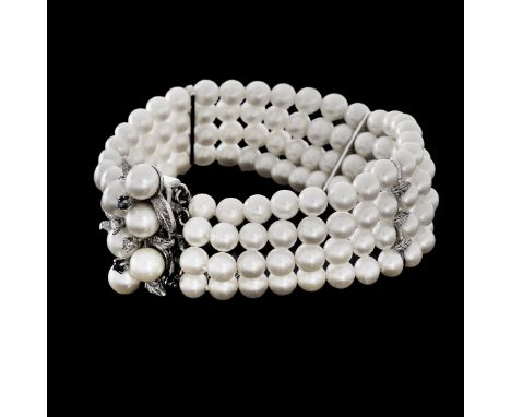 Vintage Four Strand 5mm Pearl, Diamond, Sapphire and 14 Karat White Gold Bracelet. Stamped 14K. Measures 7-1/2" L, 7/8" W. Ap