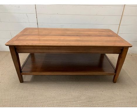 A solid coffee table with shelf under (H47cm W112cm D57cm)