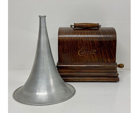 An Edison Gem phonograph in oak case with aluminium horn