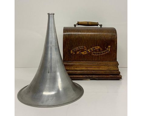 An Edison Gem phonograph in oak case with aluminium horn
