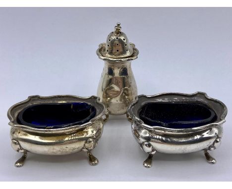 A set of hallmarked silver salts with blue glass liners AF Hallmarked Birmingham 1923.