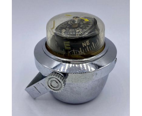 Compass in chrome, with Polcu Foreign on handle.