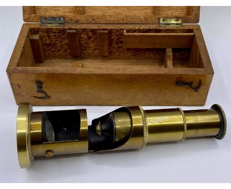  A brass microscope, cased