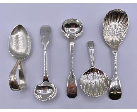 A selection of various silver spoons, with various hallmarks and makers.