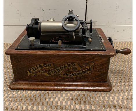An Edison Standard phonograph, black japanned metal in oak case. 