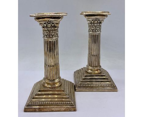 A pair of silver column themed Mappin &amp; Webb candlesticks, hallmarked.15cm H