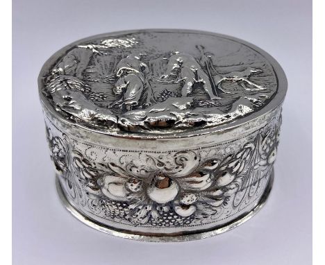 A Dutch silver lidded repousse decorated lidded pot.