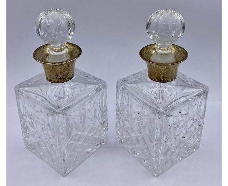 A Pair of Mappin &amp; Webb silver collared liqueur decanters, hallmarked 1984