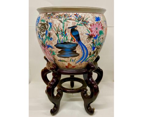 A Chinese ceramic fish bowl on stand