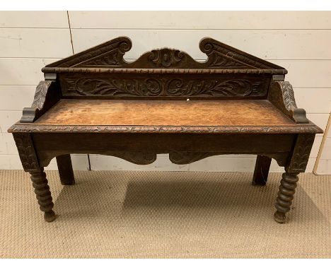 An oak carved shelf on legs (H72cm W110cm D32cm)