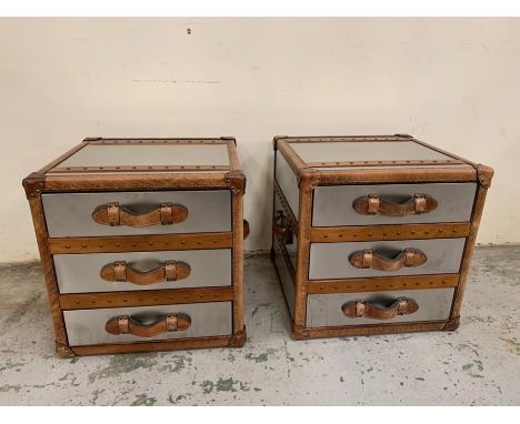 A pair of contemporary bedsides in a luggage trunk style with leather handles and metal case (Sq52cm)