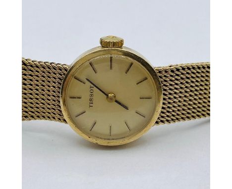 A Ladies Tissot watch on a 9ct gold, hallmarked strap total weight is (32.6g)