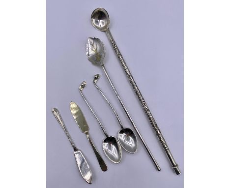 A selection of hallmarked silver cutlery to include spoons, butter knives, hot chocolate spoons.