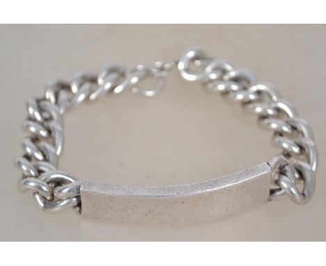 A hallmarked sterling silver gentleman's belcher link bracelet chain having an blank name plate and a bolt ring clasp. Weighs