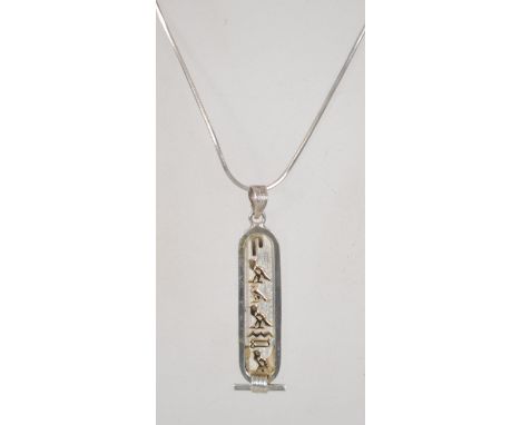 A sterling silver 925 snake link necklace chain with lobster claw clasp having a silver Egyptian hieroglyphics drop pendant. 