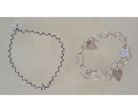 Two sterling silver 925 bracelet chains one having a heart padlock clasp and one having a toggle clasp with heart drops. Tota