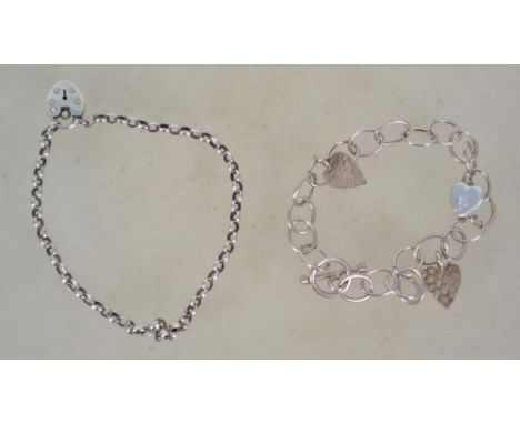 Two sterling silver 925 bracelet chains one having a heart padlock clasp and one having a toggle clasp with heart drops. Tota