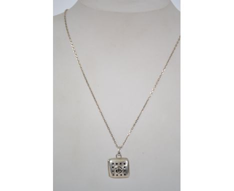 A sterling silver necklace chain with bolt ring clasp having a pierced square locket pendant with central stone symbol. Weigh