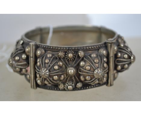 A large vintage heavy coin silver hinged bangle with rope work and pin fastening. &nbsp;Partial makers marks, measures 6cms w