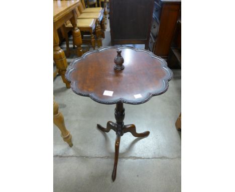 A mahogany tripod wine table