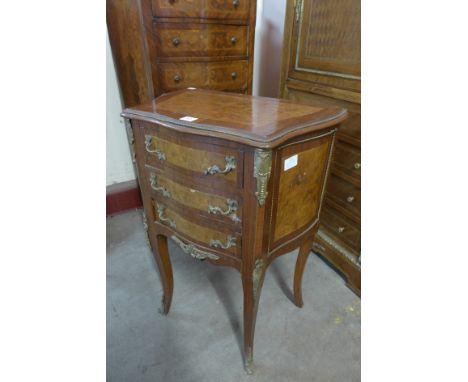 A French Louis XV style rosewood and marquetry inlaid serpentine petit commode