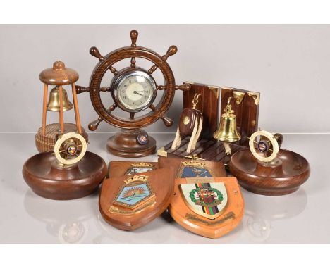 An assortment of Shipping wooden items, including nut table nut crackers, a mantle clock, novelty book ends, a small collecti