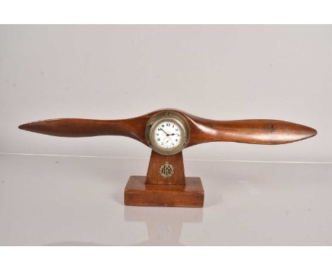 A Mantle Clock modelled as a wooden Propeller Clock, having 8 Day Movement clock to the centre, with small RFC badge lower, u