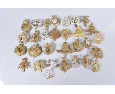 A group of British Military Cap badges, including The City of London Yeomanry 'Rough Riders, Small Arms School, Royal Enginee
