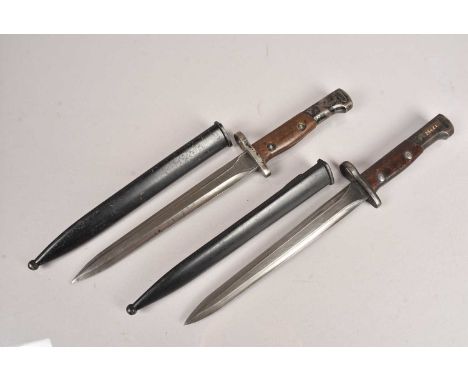 Two Belgian SAFN M1949 bayonets and scabbards,  the bayonets, one stamped SA30 with serial 2996, with scabbard serial 35573, 